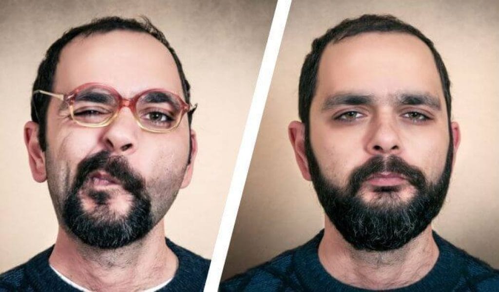 גבר מזוקן עושה פרצופים למצלמה גבר מזוקן עושה פרצופים למצלמה